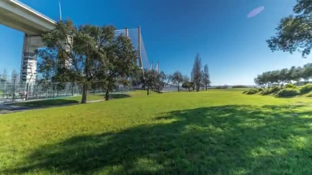 Vasco Gama Bridge Timelapse Hyperlapse Viewed Green Lawn Trees Cable — Video