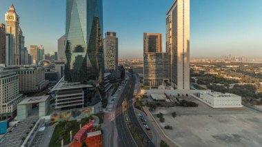 Panorama showing Dubai International Financial district aerial . View of business and financial office towers. Skyscrapers with hotels and shopping malls near downtown