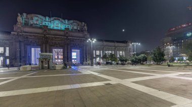 Panorama showing Milano Centrale night timelapse - the main central railway station of the city of Milan in Italy. Located on Piazza Duca d'Aosta near the long boulevard Via Vittor Pisani.