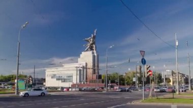 Industrial Worker and Collective Farm Girl monument from road with car traffic on intersection, timelapse hyperlapse Moscow, Russia