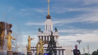 Golden fountain in the national exhibition center, Famous fountain of Friendship of Peoples timelapse hyperlapse, Moscow, Russia. Blue cloudy sky