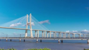 The Vasco da Gama Bridge timelapse hyperlapse. Cable-stayed longest bridge flanked by viaducts and rangeviews that spans the Tagus River in Park of Nations in Lisbon, the capital of Portugal
