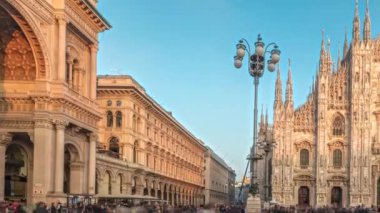 Panorama showing Milan Cathedral and historic buildings timelapse during sunset. Duomo di Milano is the cathedral church located at the Piazza del Duomo square in Milan city in Italy