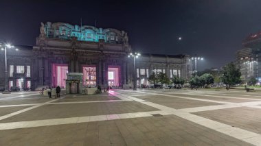 Panorama showing Milano Centrale night timelapse - the main central railway station of the city of Milan in Italy. Located on Piazza Duca d'Aosta near the long boulevard Via Vittor Pisani.