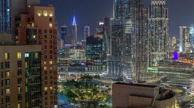 Aerial view of Dubai International Financial Centre district skyscrapers day to night transition from downtown. Office towers from glass and hotels with modern buildings