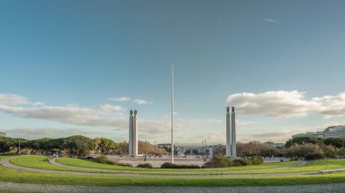 Miradouro Park Eduardo VII timelapse hyperlapse in Lisbon, Portugal, Europe. Looking towards gardens in the park with Marquess of Pombal Statue and Avenida de Liberdade in a background on cloudy day.