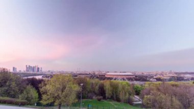 Panoramic view of Moscow City, Russia, from Sparrow Hills day to night transition timelapse. View from above after sunset