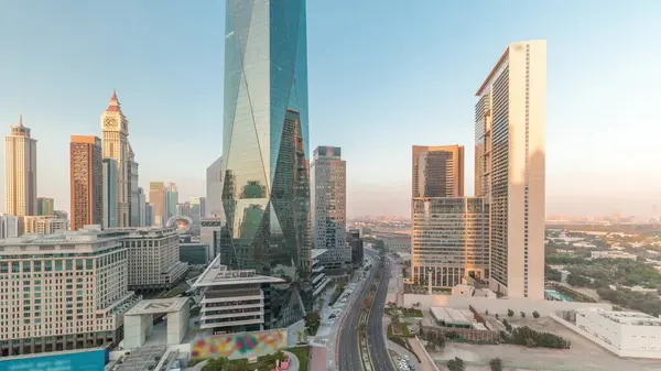 Dubai International Financial district aerial timelapse during all day. Panoramic view of business and financial office towers. Skyscrapers with hotels near downtown and shadows moving fast
