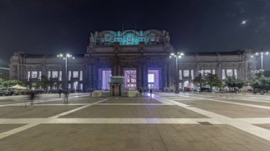 Panorama showing Milano Centrale night timelapse - the main central railway station of the city of Milan in Italy. Located on Piazza Duca d'Aosta near the long boulevard Via Vittor Pisani.