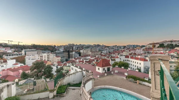 Panorama showing Jardim do Torel day to night transition timelapse, a traditional garden and viewpoint with unusual views to the city center of Lisbon. It has a terrace and a large pond. Portugal