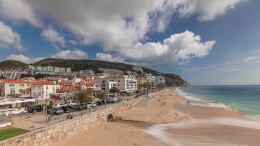 Panorama showing aerial view of Sesimbra Town and seaside walking waterfront timelapse, Portugal. Top landscape with houses and beach from fortress. Resort in Setubal district clipart