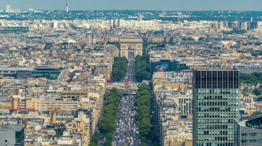 Aerial view of Paris and The Arc de Triomphe with Champs Elysees timelapse from the top of the skyscrapers in Paris business district La Defense. Traffic on the street. Paris, France clipart