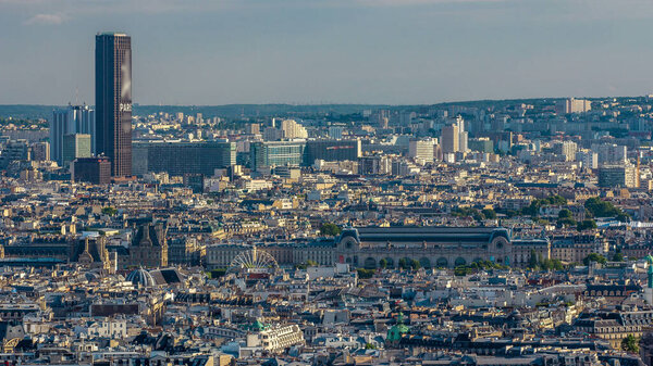Panorama of Paris from above timelapse, France. Musee d'Orsay and other buildings. Aerial top view from Montmartre viewpoint. Sunny day with blue cloudy sky.