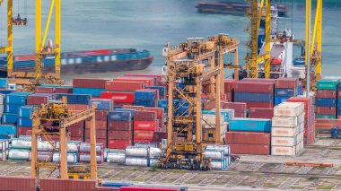 Port of Singapore timelapse. Bird eye panoramic aerial view of busiest Asian cargo port with hundreds of ships loading export and import goods and thousands of containers in harbor