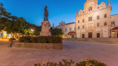 Panorama showing Sa da Bandeira Square with a view of Santarem See Cathedral aka Nossa Senhora da Conceicao Church day to night transition timelapse, built in Mannerist style. Walking area. Portugal clipart