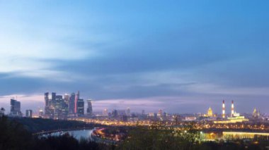 Panoramic view of Moscow City, Russia, from Sparrow Hills day to night transition timelapse from above. Cloudy colorful sky over skyscrapers