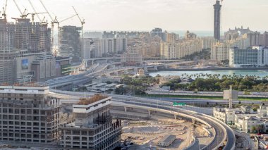 Palm Jumeirah Highway bridge aerial timelapse. View from Internet city with traffic. Dubai, United Arab Emirates clipart