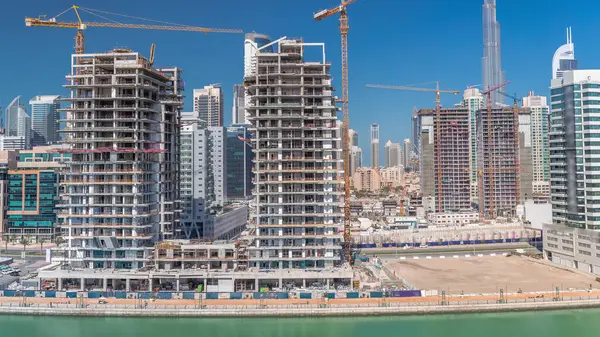 Vista Aérea Rascacielos Construcción Con Enormes Grúas Timelapse Dubai Distrito —  Fotos de Stock