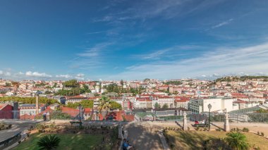 Panorama showing aerial view over the center of Lisbon timelapse from the viewpoint called: Miradouro de Sao Pedro de Alcantara featuring the Baixa neighborhood from above and Castelo Sao Jorge. clipart