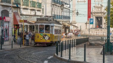People getting on the tram timelapse, at a station in Luis de Camoes square, in the neighborhood of Chiado. Traffic on the street with cars and public transport