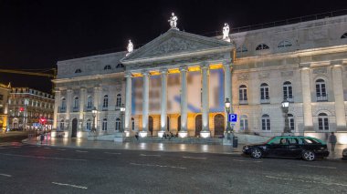 Rossio square in front of the illuminated National Theater Dona Maria II night timelapse hyperlapse in the capital of Portugal. Lisbon