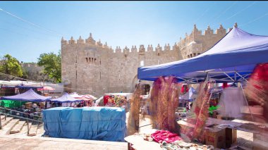 Damascus Gate or Shechem Gate timelapse hyperlapse, one of the gates to the Old City of Jerusalem, Israel. Crowd of people near market clipart