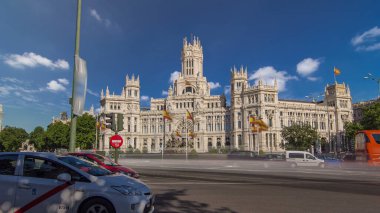 Cibeles fountain and cars traffic at Plaza de Cibeles in Madrid in a beautiful summer day, Spain timelapse hyperlapse clipart