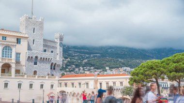 Prince's Palace of Monaco timelapse. Official residence of the Prince of Monaco. Cloudy sky at summer day. People walking around clipart