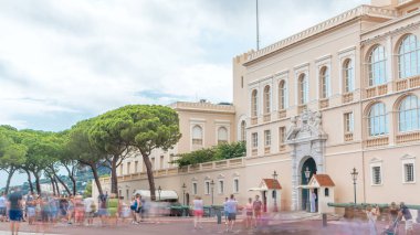 Prince's Palace of Monaco timelapse. Official residence of the Prince of Monaco. Cloudy sky at summer day. People walking around clipart