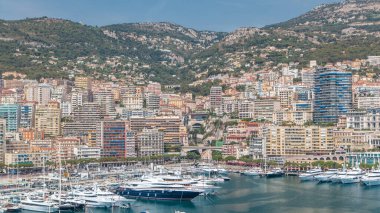 Monte Carlo city aerial panorama timelapse with bridges near railway station. Port Hercule from top. View of luxury yachts, boats and historic buildings in harbor of Monaco, Cote d'Azur. clipart