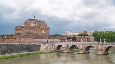 Saint Angel castle timelapse and bridge over the Tiber river in Rome, Italy. Cloudy sky