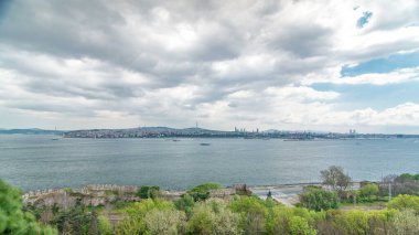 Istanbul and Bosphorus panoramic view from the Topkapi Palace timelapse. Top view of downtown and Camlica hill. Monument to Admiral Piri Reis near Gospel Pavilion. Travel Turkey