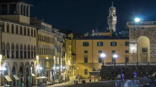 stock image Tourists walking on a sloping square Piazza Pitti before the Palace Pitti at night Florence. Top view with historical houses and evening illumination