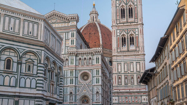 Facade and dome of The Basilica di Santa Maria del Fiore day to night timelapse which is the cathedral church (Duomo) of Florence in Italy. Evening illumination of bell tower