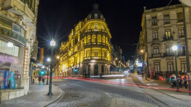 The crossroads near the Sao Bento Railway Station night timelapse hyperlapse. Illuminated historic building and street lights