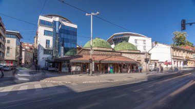 Bosniak Institute in a renovated Turkish bathhouse, includes a library and art collection focusing on culture. Street with cars and public transport at Sarajevo city center. Bosnia and Herzegovina clipart