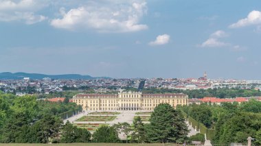 Beautiful view of famous Schonbrunn Palace timelapse hyperlapse with Great Parterre garden and lake in Vienna, Austria. City panorama on a background clipart