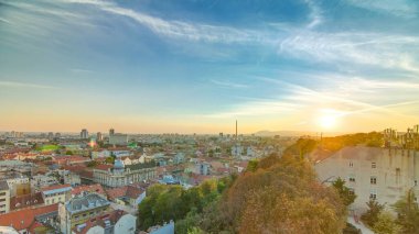 Aerial view at Zagreb downtown timelapse, beautiful sunset, Croatia capital city. Aerial cityscape Zagreb town. Top view from Kula Lotrscak tower viewpoint