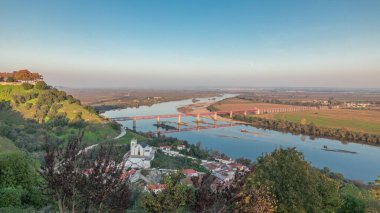 Panorama showing the Castle of Almourol on hill in Santarem aerial timelapse. A medieval castle atop the islet of Almourol in the middle of the Tagus River with bridge over it. Portugal clipart