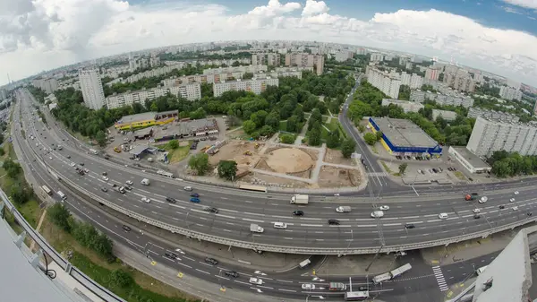 stock image Top view from above of traffic on the elevated avenue road aerial timelapse overpass on Yaroslavl highway in Moscow, Russia. Residential block behind