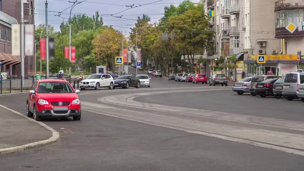 stock image Cars parked on a road with new tram rails in Kharkiv, Ukraine. Traffic on intersection of Trinkler and Mayakovsky street near Sumskoy market, Kharkov city timelapse