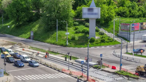 stock image Repair works on the street aerial timelapse. Laying of new tram rails on a city street. Installation of new modern silent railway rails for trams during reconstruction