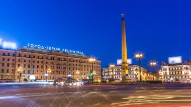 Vosstaniya Rebellion Square Night Timelapse and the Majestic Obelisk Hero City Leningrad Illuminated, with Moscow Railway Station and Bustling Urban Traffic in Vibrant St. Petersburg, Russia clipart