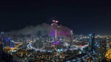 Dubai Burj Khalifa New Year fireworks celebration timelapse and the Fire accident occurred from the The Address Hotel at Dubai, UAE. View from top fisheye clipart