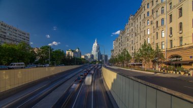 Cars traffic on Garden-Triumph street timelapse hyperlapse in Moscow, Russia. Blue cloudy sky at summer day. Circular avenue goes around central Moscow along old rampart surrounded Zemlyanoy Gorod clipart