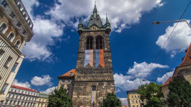 Jindrisska Tower timelapse hyperlapse - the highest belfry in Prague. The gothic tower itself was built in 1472 - 1475 beside the Church of St Henry and Cunigunde, Czech Republic clipart