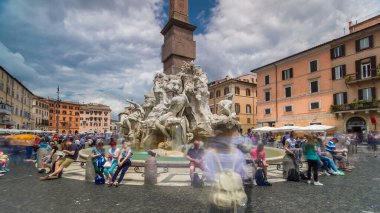 Piazza Navona, the fountain of four rivers timelapse hyperlapse. People sitting around. Cloudy sky. Italy, Rome clipart