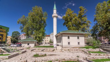 Bakr-babina mosque in Sarajevo timelapse hyperlapse. Bosnia and Herzegovina. Stari Grad ruins on foreground clipart