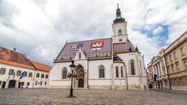 Church of St. Mark timelapse hyperlapse and parliament building in downtown Zagreb, Croatia. Cloudy sky