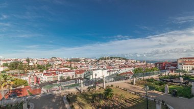 Panorama showing aerial view over the center of Lisbon timelapse from the viewpoint called: Miradouro de Sao Pedro de Alcantara featuring the Baixa neighborhood from above and Castelo Sao Jorge. clipart